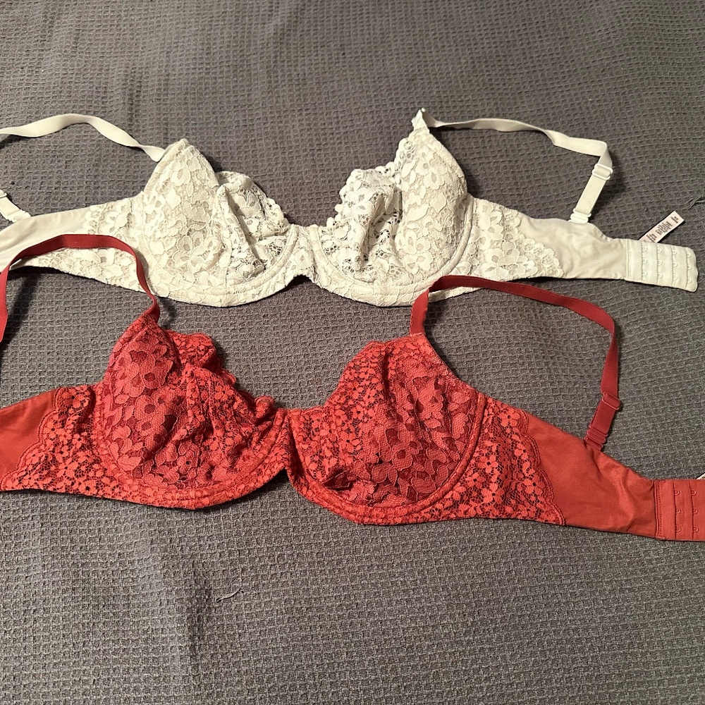 Two Victorias Secret 34DDD Body by Victoria bra. Both are lace, unlined.